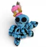Amigurumi pieuvre décorative originale faite main avec détails dorés et perle.